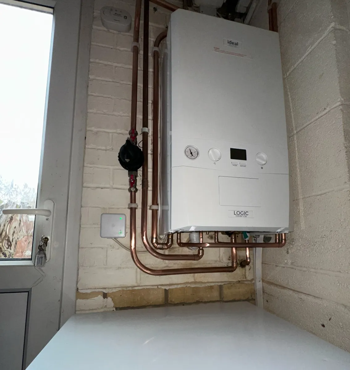 Ideal Logic Combi C30 installation with neat copper pipework and Hive receiver