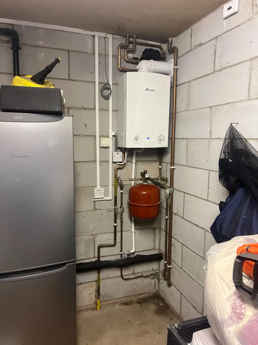 Worcester Bosch combi boiler installation in utility room with expansion vessel