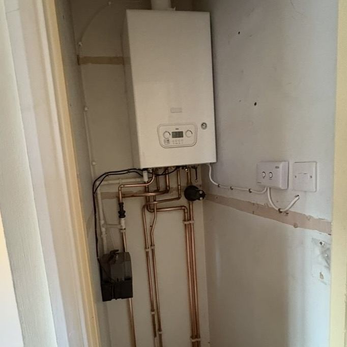 Compact boiler installation in cupboard